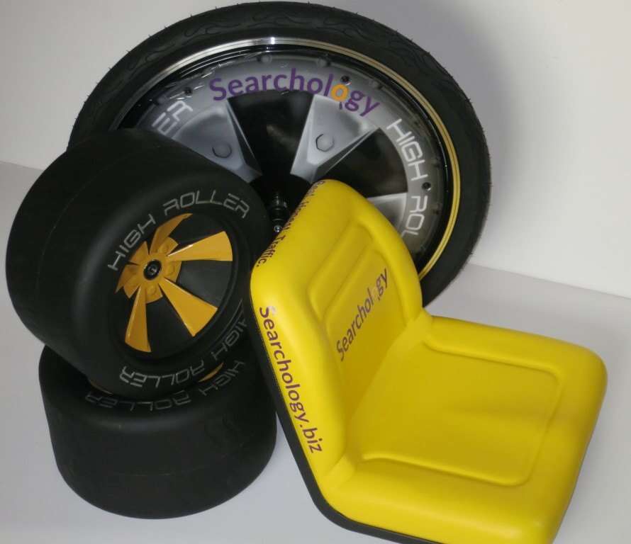 Custom graphics on seat, wheel cover, and wheels